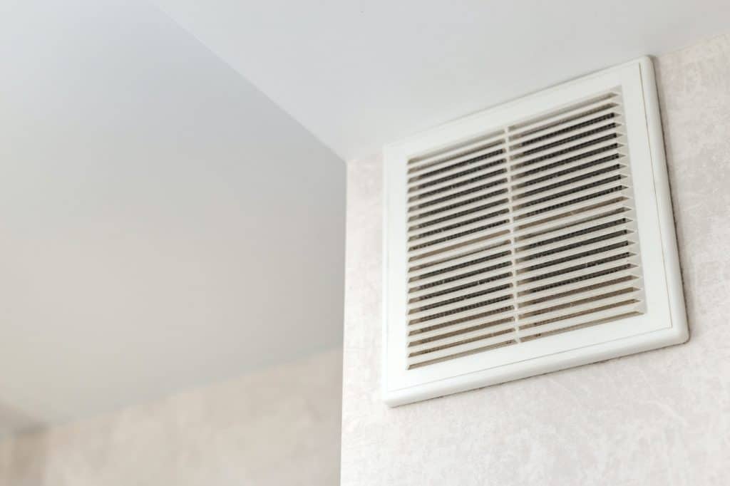 Dirty ventilation grille in the kitchen on the wall. Communication in the kitchen.